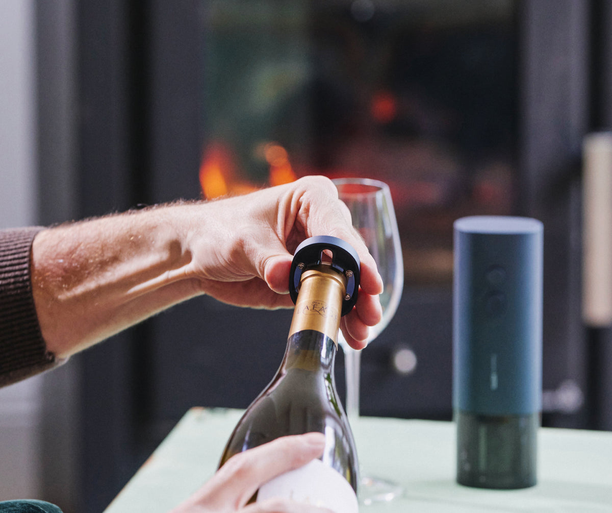 Using the HOTO foil cutter on the neck of a wine bottle