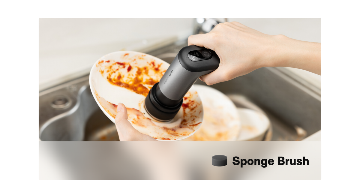 Sponge pad washing a plate in a kitchen sink